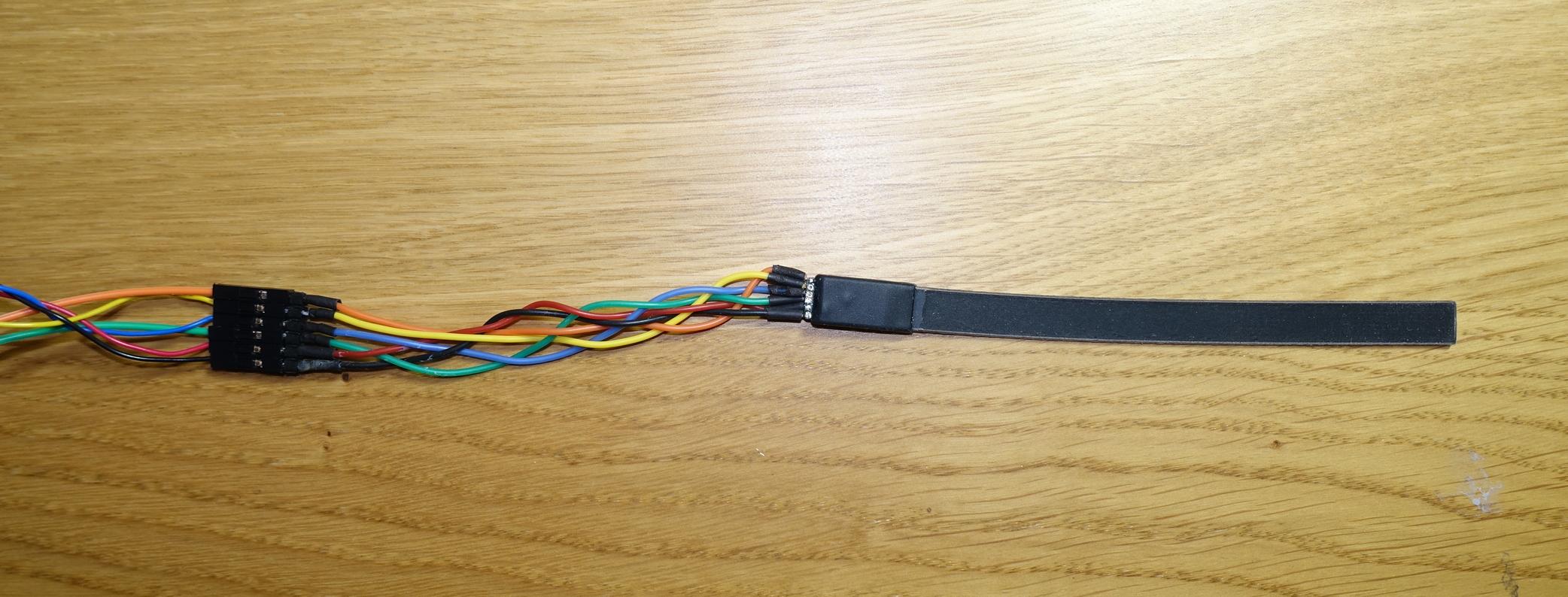 Bendlabs single-axis flex-sensor with extension wires soldered on to break-out connector.
